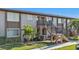Two story building with landscaped grounds at 25100 Sandhill Blvd # B-103, Punta Gorda, FL 33983