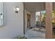 Ground level entrance with two chairs and small porch at 25100 Sandhill Blvd # B-103, Punta Gorda, FL 33983