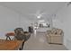 Living area with two couches and a view into the kitchen at 25100 Sandhill Blvd # B-103, Punta Gorda, FL 33983