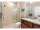 Bathroom with shower, granite vanity, and toilet at 2759 Lavandula Ct, North Port, FL 34289