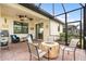 Relaxing screened patio with fire pit and seating area, perfect for outdoor entertaining at 2759 Lavandula Ct, North Port, FL 34289