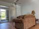 Living room with sliding doors to the screened patio at 2761 Rhumba Ter, North Port, FL 34286