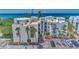 Oceanfront condo building with parking and lush landscaping at 2950 N Beach Rd # A315, Englewood, FL 34223