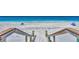 Steps leading down to a pristine beach with blue waters at 2950 N Beach Rd # A315, Englewood, FL 34223