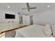 King-size bed, dresser and en-suite bathroom access at 2950 N Beach Rd # A315, Englewood, FL 34223