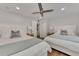 Guest bedroom with two twin beds and access to a bathroom at 2950 N Beach Rd # A315, Englewood, FL 34223