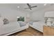 Guest bedroom with two twin beds and a ceiling fan at 2950 N Beach Rd # A315, Englewood, FL 34223