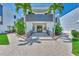 Building exterior features a modern design and lush landscaping at 2950 N Beach Rd # A315, Englewood, FL 34223
