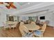 Relaxing community room with tables, chairs, and a TV at 2950 N Beach Rd # A315, Englewood, FL 34223