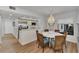 Charming dining area features a round table and wicker chairs at 2950 N Beach Rd # A315, Englewood, FL 34223