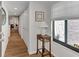 Condo entryway with wood floors and view into living room at 2950 N Beach Rd # A315, Englewood, FL 34223