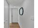 Bright and airy entryway with updated flooring and mirror at 2950 N Beach Rd # A315, Englewood, FL 34223