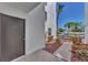 Condo building exterior with entrance and landscaping at 2950 N Beach Rd # A315, Englewood, FL 34223