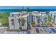Oceanfront condo building with ample parking and lush landscaping at 2950 N Beach Rd # A315, Englewood, FL 34223