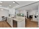 Modern kitchen with white cabinets, granite counters, and stainless steel appliances at 2950 N Beach Rd # A315, Englewood, FL 34223