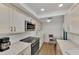 Modern kitchen with stainless steel appliances and granite countertops at 2950 N Beach Rd # A315, Englewood, FL 34223
