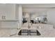 Kitchen sink and countertops with view to living and dining areas at 2950 N Beach Rd # A315, Englewood, FL 34223