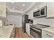 Modern kitchen with stainless steel appliances and granite countertops at 2950 N Beach Rd # A315, Englewood, FL 34223