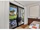 Sliding glass doors open to a relaxing patio overlooking lush landscaping at 2950 N Beach Rd # A315, Englewood, FL 34223