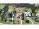 Aerial view showcasing a home's location on a waterfront lot with pool and surrounding properties at 4658 Arlington Dr, Placida, FL 33946