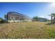 Expansive backyard view with the house from afar at 4658 Arlington Dr, Placida, FL 33946