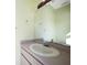 Simple bathroom with single vanity and large mirror at 4658 Arlington Dr, Placida, FL 33946