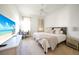 Bedroom with a king-size bed, TV, desk, and carpeted floors at 4658 Arlington Dr, Placida, FL 33946