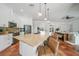 Bright, open kitchen with large island, pendant lighting, and tile flooring at 4658 Arlington Dr, Placida, FL 33946