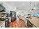 Modern kitchen with stainless steel appliances, granite countertops, and ample cabinetry at 4658 Arlington Dr, Placida, FL 33946