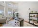 Home office with ample natural light, a modern desk, and comfortable seating at 4658 Arlington Dr, Placida, FL 33946