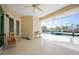 Spacious screened patio with pool views, seating area, and canal access at 4658 Arlington Dr, Placida, FL 33946