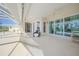 Covered patio with ceiling fan and sliding glass doors leading to the pool area at 4658 Arlington Dr, Placida, FL 33946