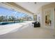 Screened patio with seating, pool, and canal views at 4658 Arlington Dr, Placida, FL 33946