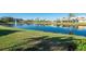 Serene lake view with fountain and reflection of homes at 5015 Seagrass Dr, Venice, FL 34293