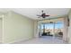 Living room with sliding doors opening to a patio and view of water at 5015 Seagrass Dr, Venice, FL 34293