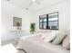 Bright bedroom with a queen bed and large window at 6192 Kambach St, Port Charlotte, FL 33981