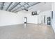 Spacious garage with epoxy flooring and storage at 6192 Kambach St, Port Charlotte, FL 33981