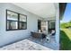 Covered patio with seating area and view of backyard at 6192 Kambach St, Port Charlotte, FL 33981