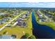 Beautiful aerial view of a community with homes, canals, and lush landscaping at 646 Boundary Blvd, Rotonda West, FL 33947