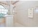 Modern bathroom with a walk-in shower, tiled walls, and updated fixtures at 646 Boundary Blvd, Rotonda West, FL 33947