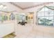 Large bathroom with soaking tub, double vanity, and natural light at 646 Boundary Blvd, Rotonda West, FL 33947