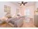 Bedroom with two twin beds, plush carpet, and decorative wall art at 646 Boundary Blvd, Rotonda West, FL 33947