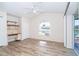 Bright, unfurnished bedroom with wood-look flooring, closet and built in desk at 646 Boundary Blvd, Rotonda West, FL 33947