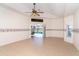 Spacious bedroom with tile flooring, and access to a private screened-in patio and pool at 646 Boundary Blvd, Rotonda West, FL 33947