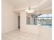 Dining area with tile floors and large windows overlooking the lanai and pool at 646 Boundary Blvd, Rotonda West, FL 33947