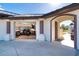 View of a garage with a motorcycle parked inside and a paved driveway at 646 Boundary Blvd, Rotonda West, FL 33947