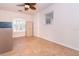 Empty home office with tile flooring, a ceiling fan, and window with blinds at 646 Boundary Blvd, Rotonda West, FL 33947