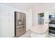 Bright kitchen featuring white cabinetry, stainless steel appliances, and an island at 646 Boundary Blvd, Rotonda West, FL 33947