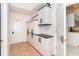 Laundry room with white cabinets, tile flooring, and access to the garage at 646 Boundary Blvd, Rotonda West, FL 33947