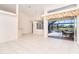Living and dining area with tile floors, high ceilings, and views of the pool at 646 Boundary Blvd, Rotonda West, FL 33947